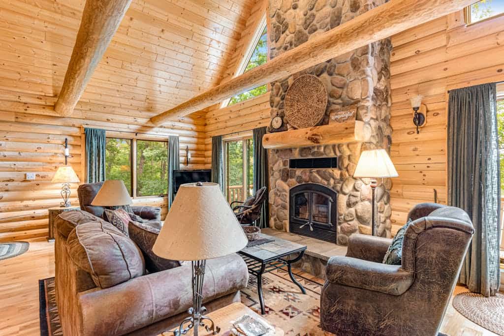 Riverfront cabin with a dock, kayaks and a canoe - firepit and water views