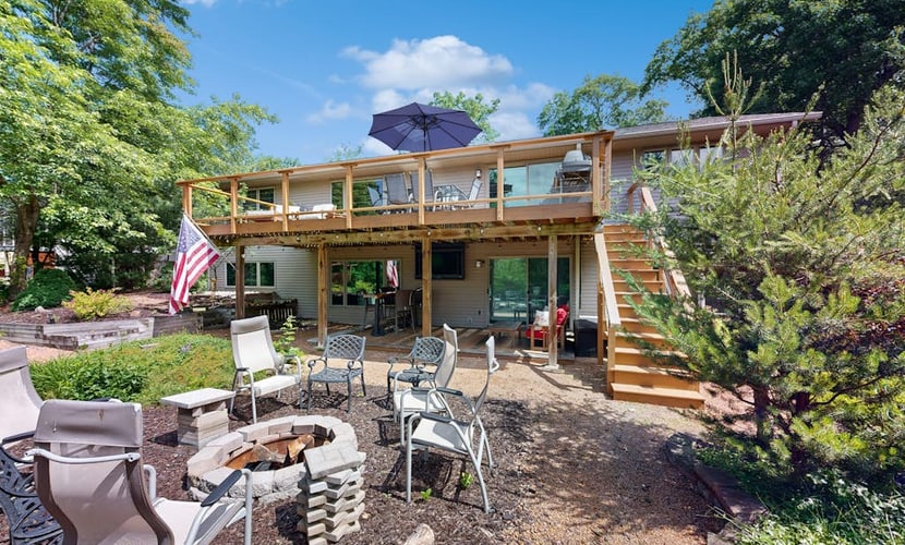 Green side smart home with golf, beach/lake access, off-site dock & EV charger