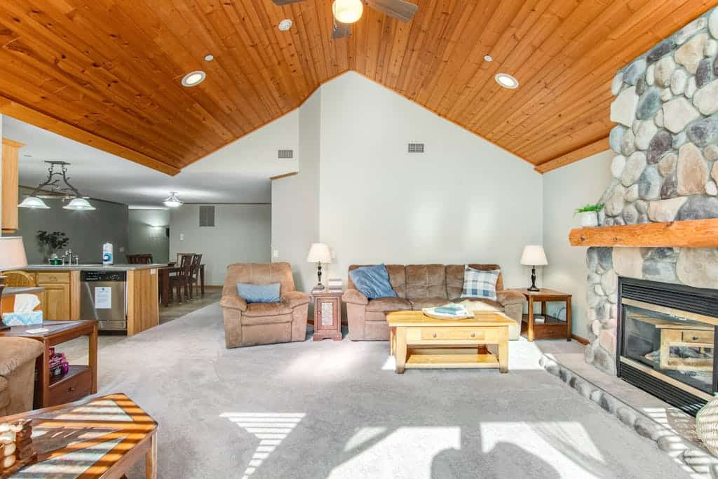 Riverfront golf resort condo with pool, hot tub, volleyball, & fairway-view deck