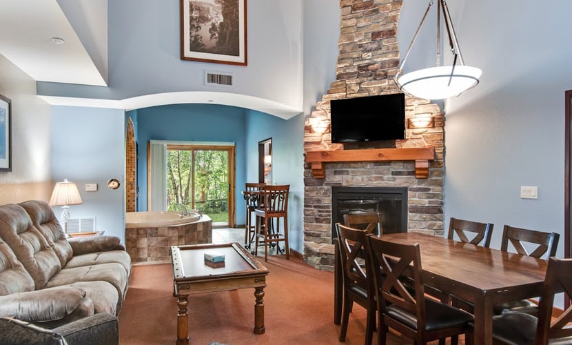 Ground-floor condo with patio, fireplace, jetted tub, & central AC