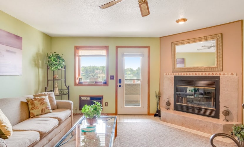 Waterfront condo with resort amenities, grill, firepit, jetted tub, & partial AC