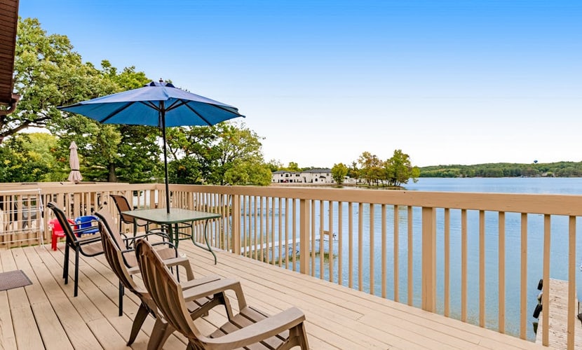 Lakefront dog-friendly condo near skiing with private beach access, views & dock
