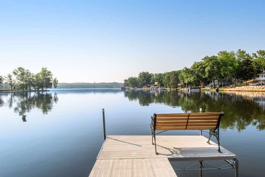 Lakefront condo with deck, amazing views, private beach access, fireplace & dock