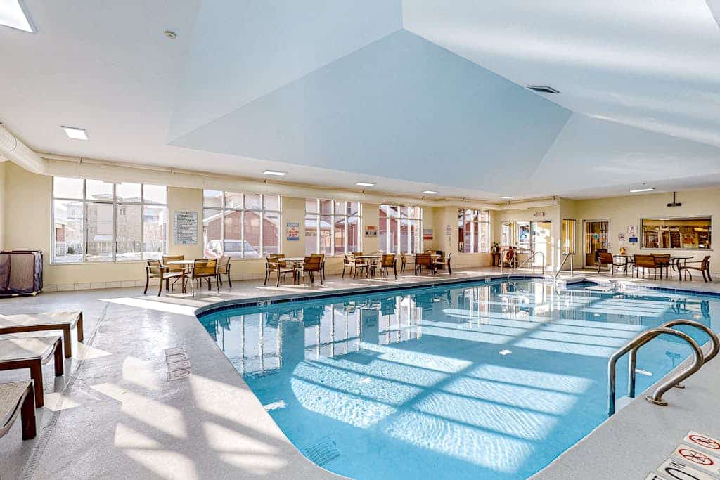 Experience laid-back lakefront living at this Delton Grand condo with pools