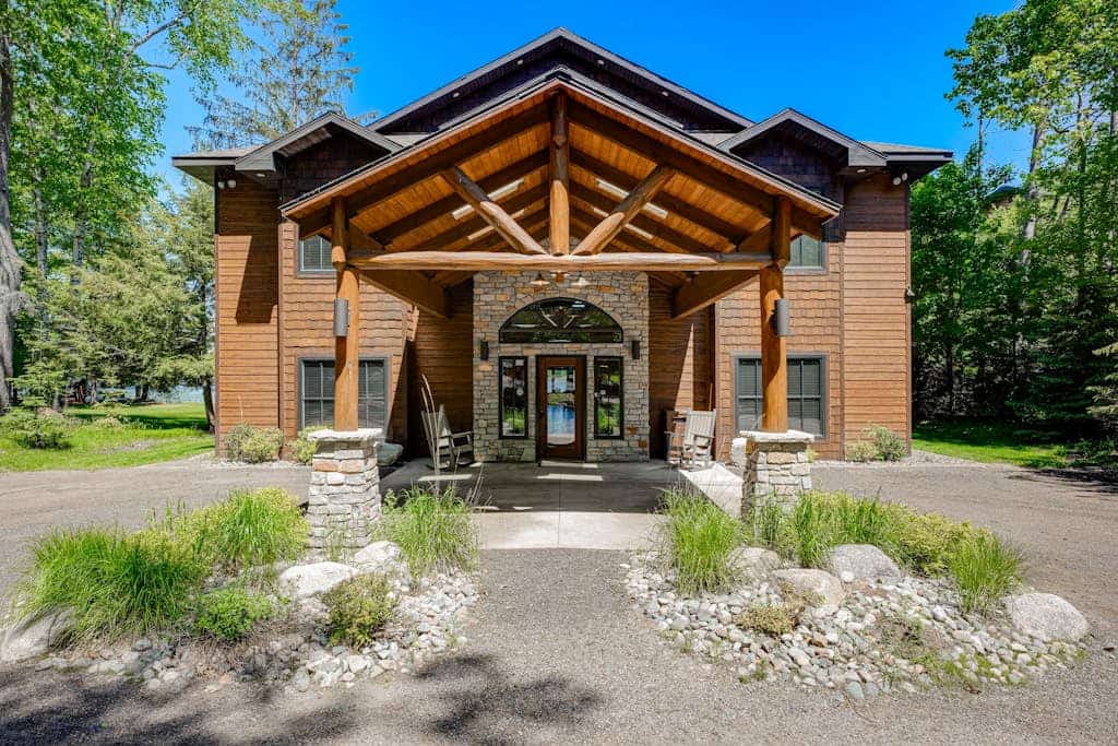 Luxury lakefront home with high-speed WiFi, dock, private beach, & theater room