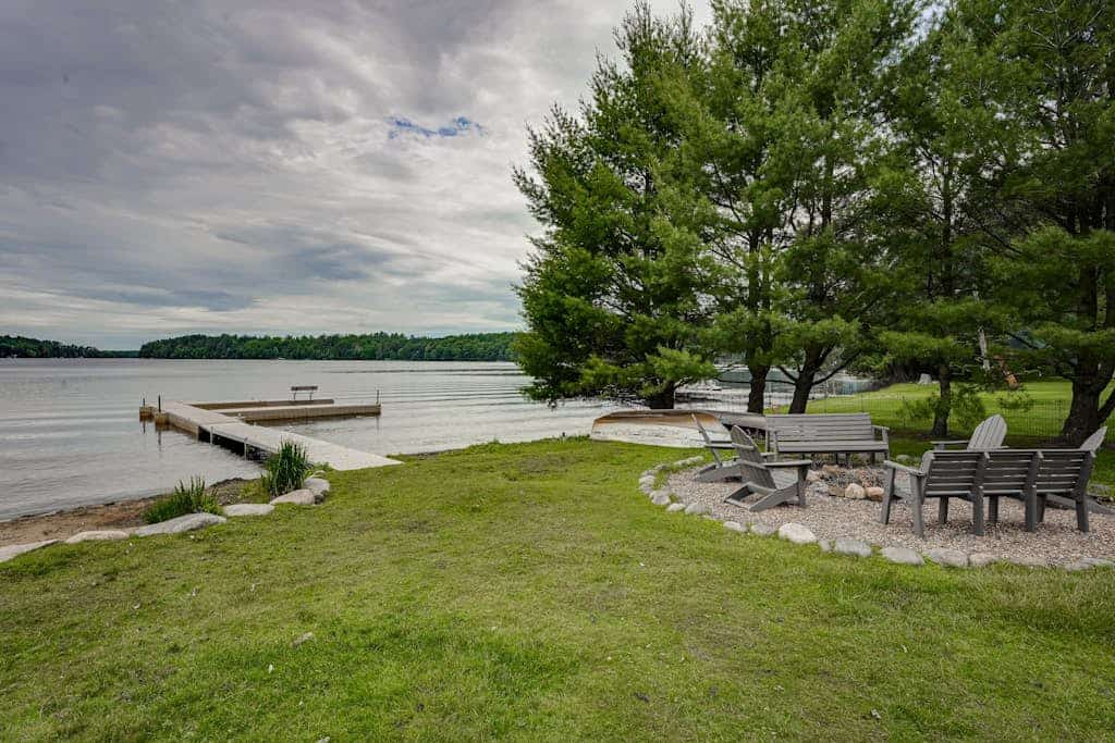 Lakefront home with private dock, firepit, playground & lake views