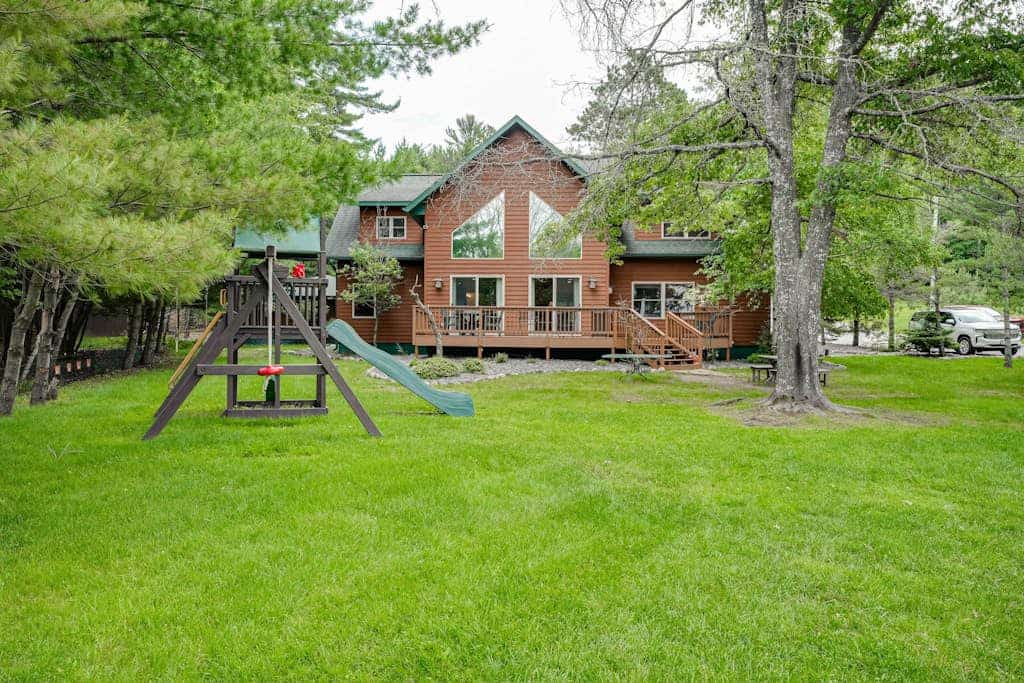 Lakefront home with private dock, firepit, playground & lake views