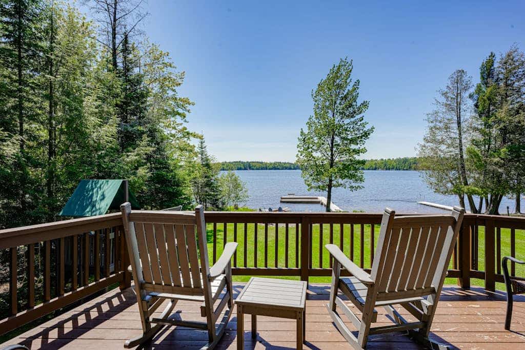 Lakefront lodge with private dock, firepit, deck & sunset views