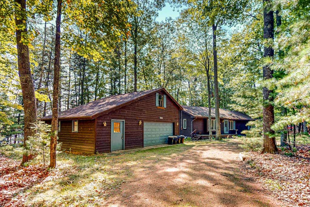 Lakefront, dog-friendly home with canoe, firepit, large deck, & washer/dryer
