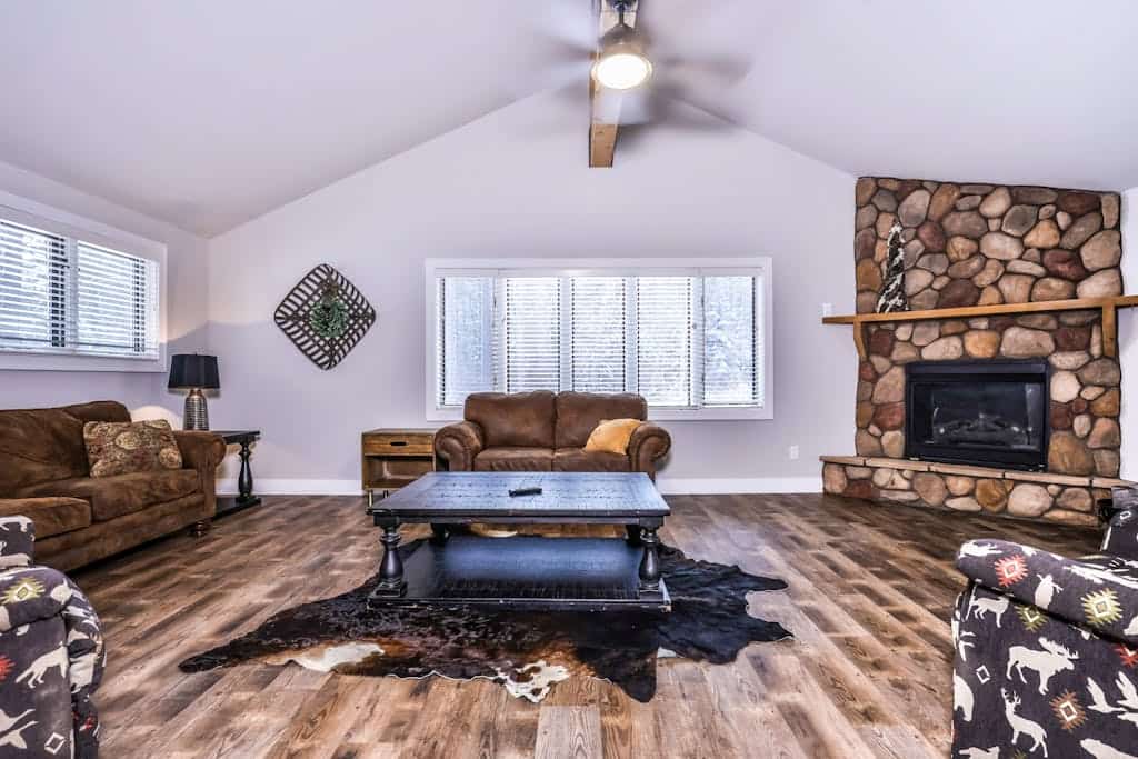 Updated, tree-lined home on the snowmobile trail with gas fireplace & firepit