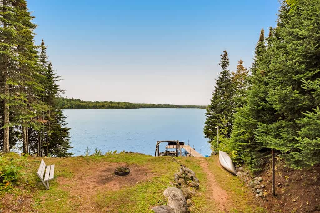 Spacious lakefront home with pier views, canoe, and fire pit - family-friendly