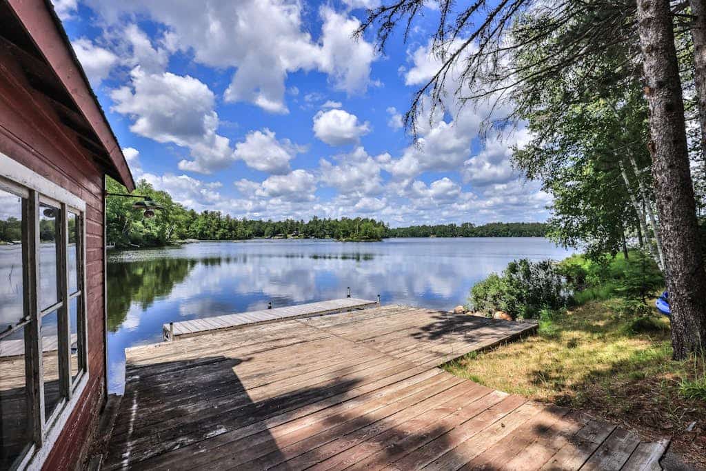 History-filled lakefront home with dock, fire pit, fireplace, & kayaks - dogs OK