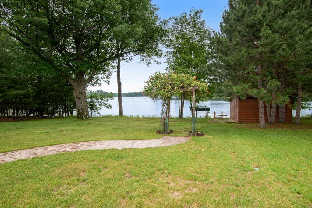 Dog-friendly lakefront getaway with dock, firepit, wet bar, game room, & AC