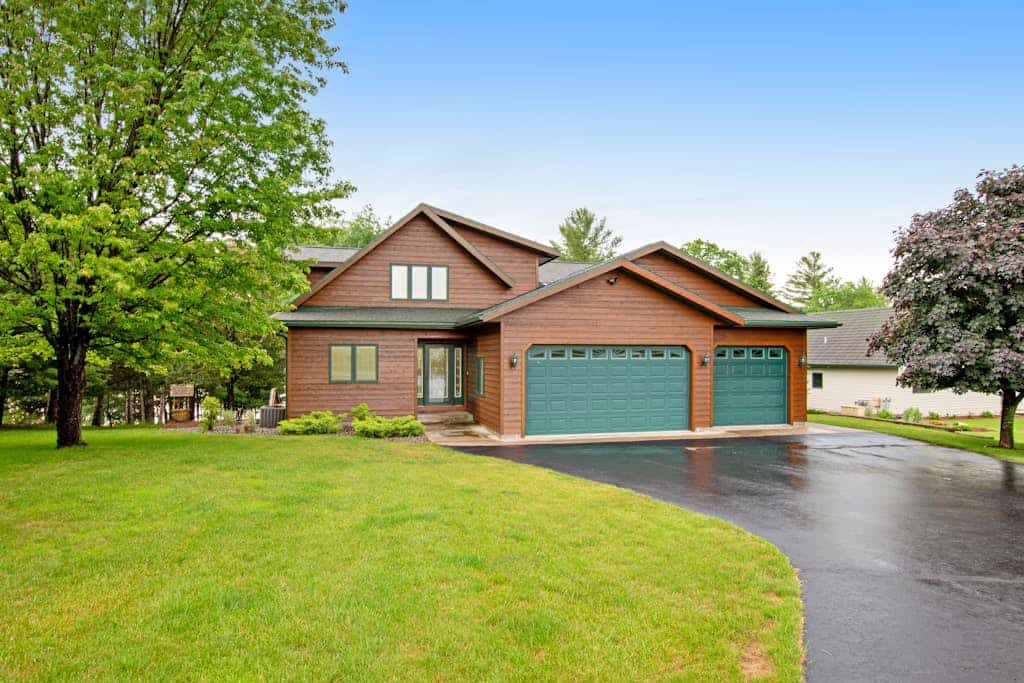 Dog-friendly lakefront getaway with dock, firepit, wet bar, game room, & AC