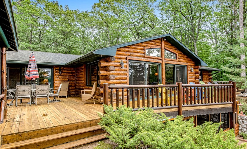 Lakefront log cabin on 3.5 acres with dock, gazebo & sunset views - dog-friendly