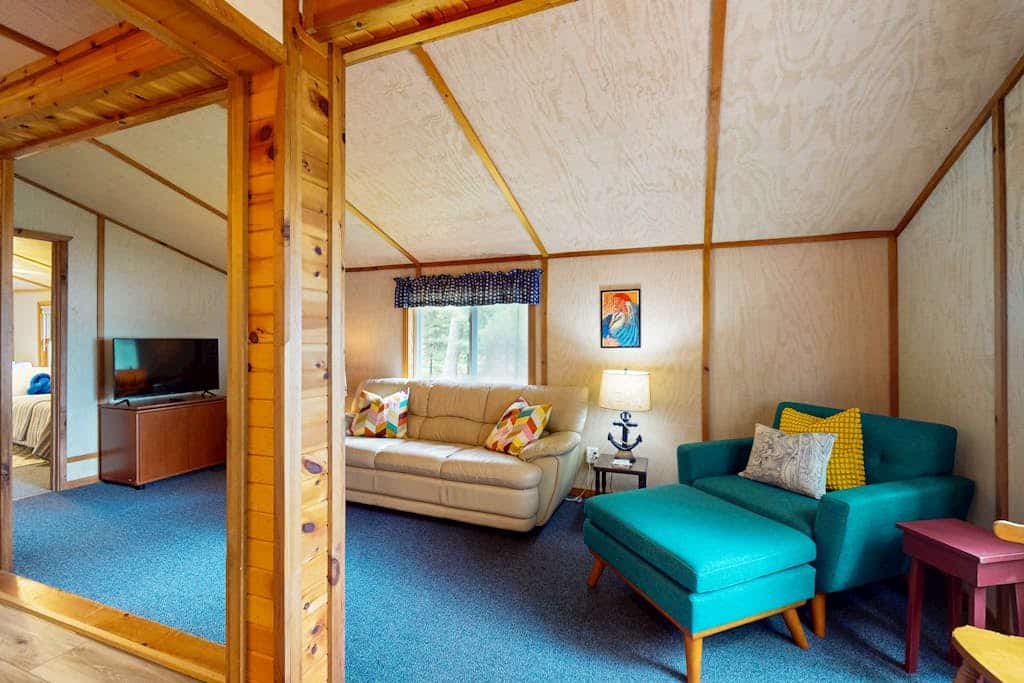 Lakefront cottage w/ a dock, shared furnished patio, firepit, & a paddleboat