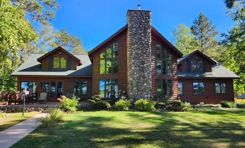 Lakefront home with game rooms, dock, kayaks, private beach, fireplace, firepit