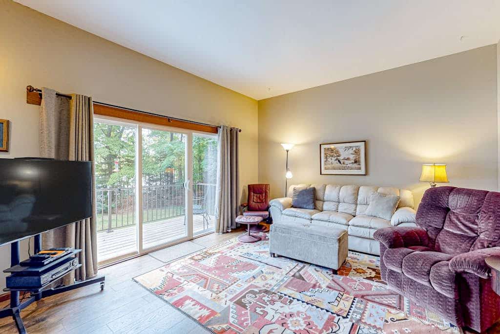 Dog-friendly lakefront home with a private beach, dock, firepit, & kayaks