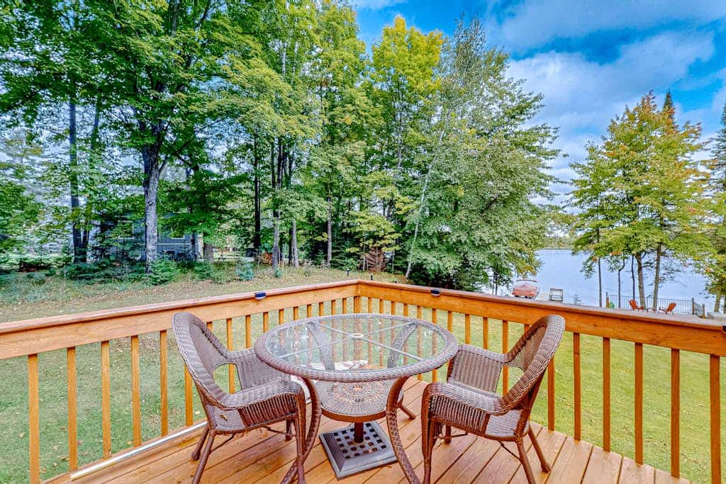 Dog-friendly lakefront home with a private beach, dock, firepit, & kayaks