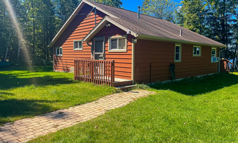 Dog-friendly lakefront property with dock, boat lift, firepit, & hot tub