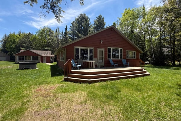 Dog-friendly lakefront property with dock, boat lift, firepit, & hot tub