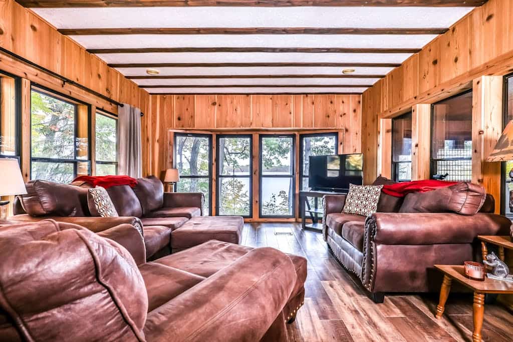 Lakefront home with private dock, screened porch, woodstove, fast WiFi, & W/D