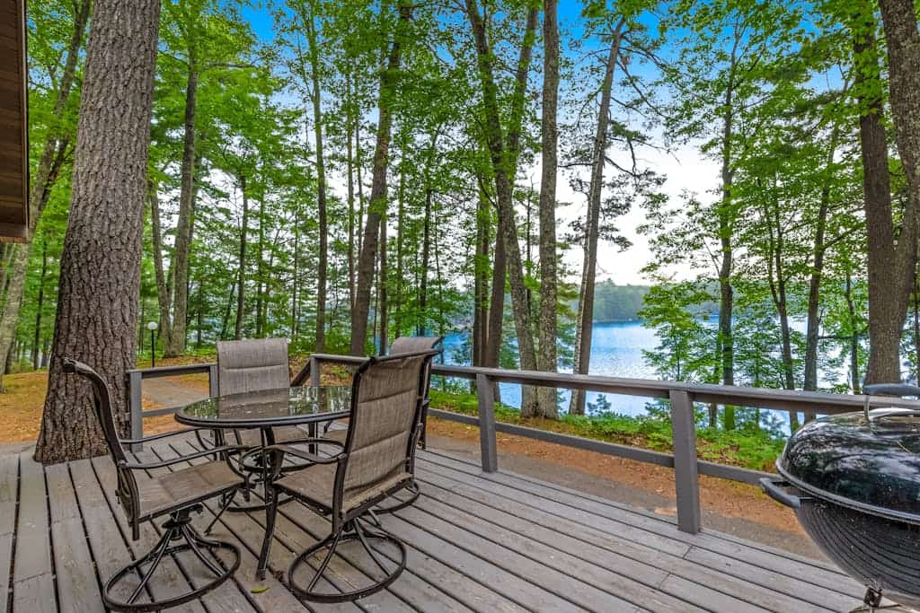 Snowy lake-view cabin with fireplace, full kitchen, TV, dock, & DVD player
