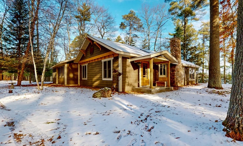Sprawling lakeside home with dock, kayaks, pool table, fireplace, grill, & AC