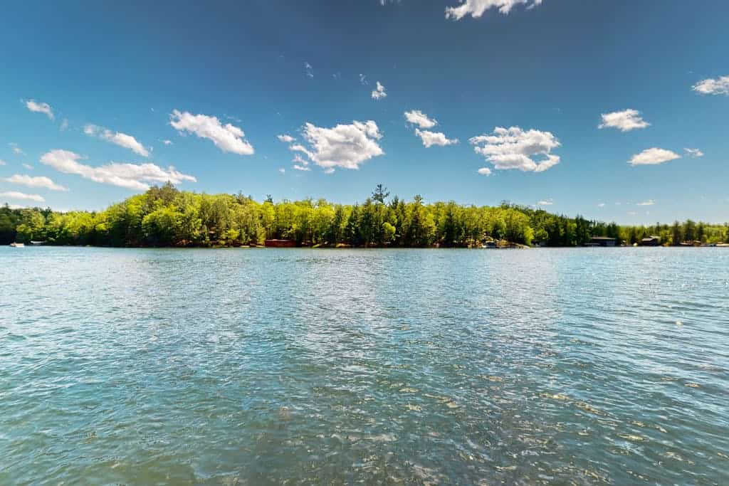 Gorgeous lakefront home with dock, sandy beach area, fireplace, huge deck & WIFI
