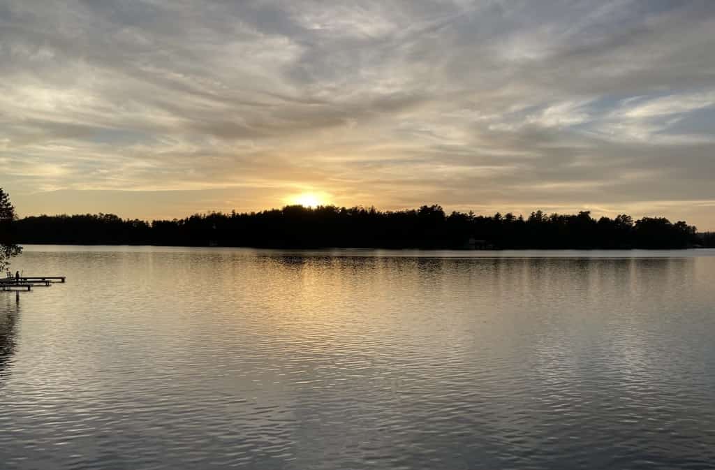 Gorgeous lakefront home with dock, sandy beach area, fireplace, huge deck & WIFI