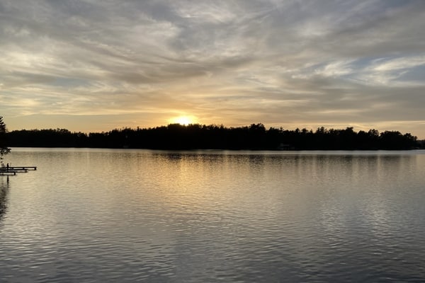 Gorgeous lakefront home with dock, sandy beach area, fireplace, huge deck & WIFI