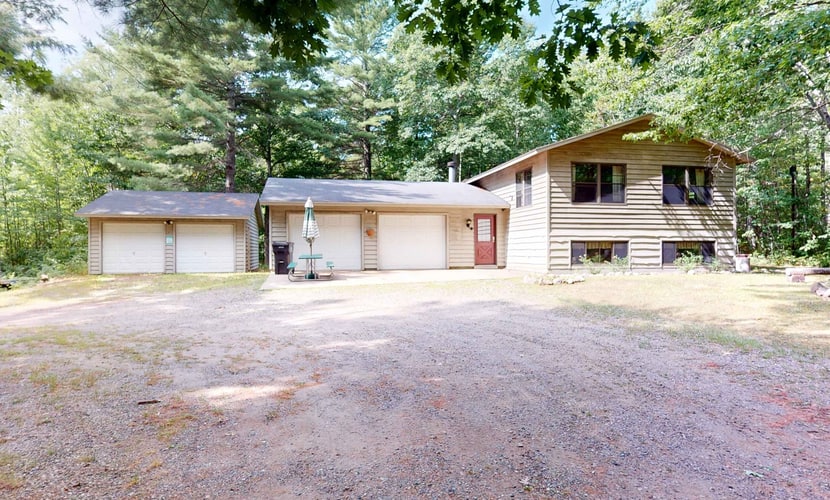 Cozy wooded home w/ access to snowmobile trail, near town, lakes, & bike trails