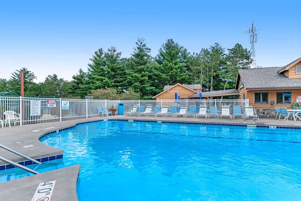 Golf course-front condo with pool, hot tub, dock, tennis, golf, & private beach