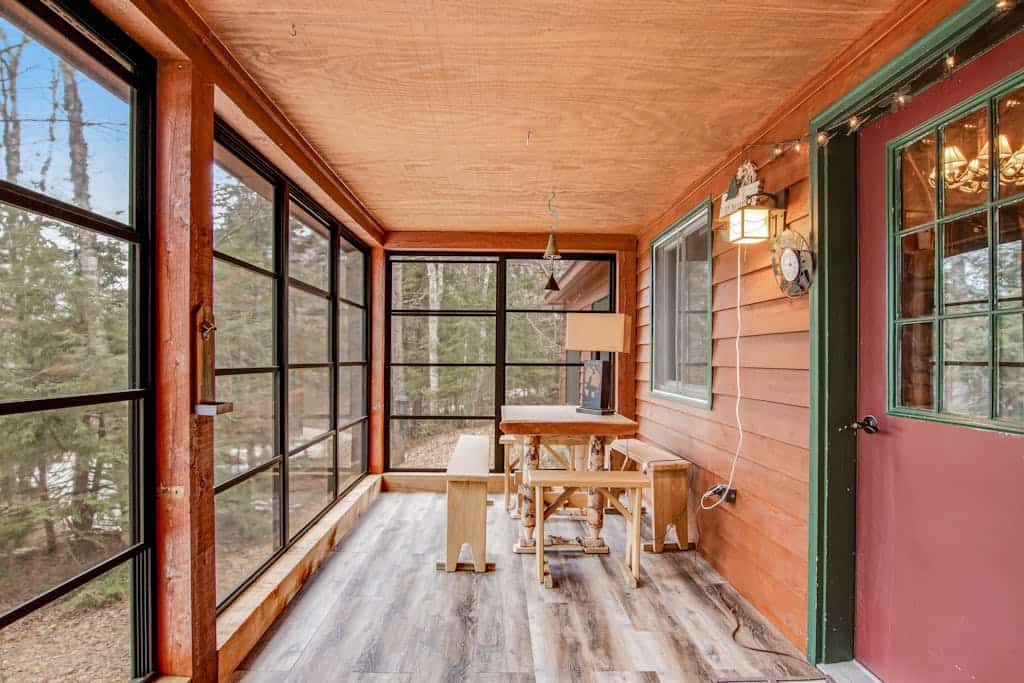 Riverfront vacation home with a dock, wood stove, full kitchen, & firepit