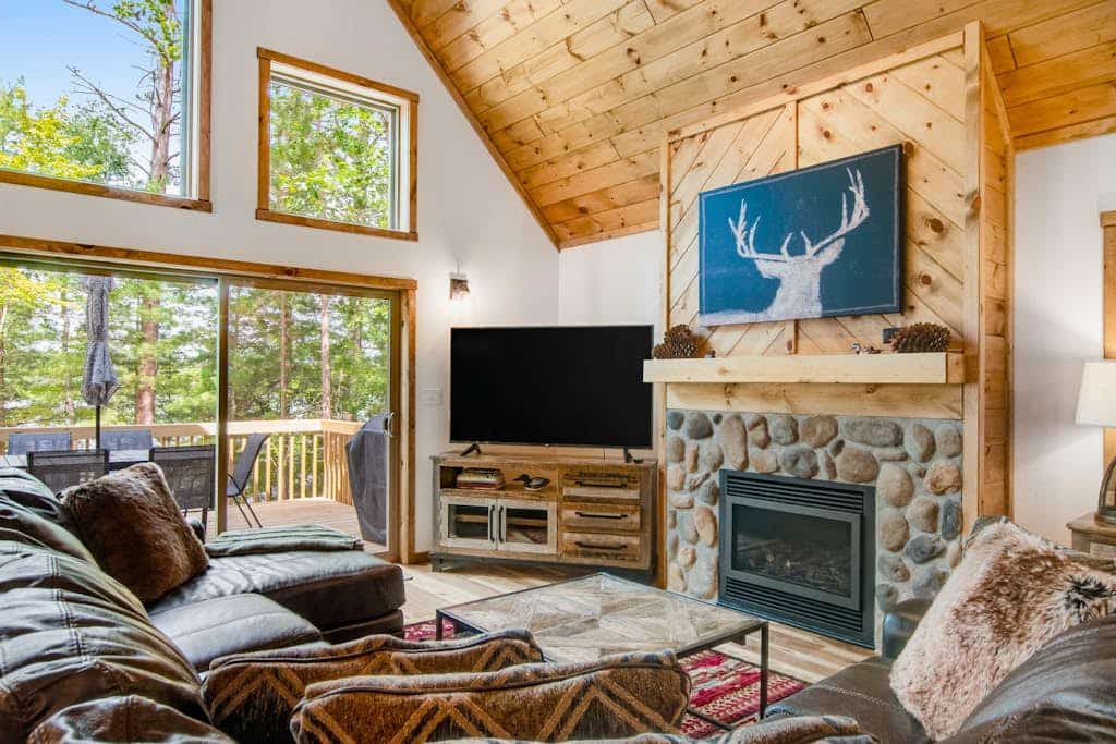 Gorgeous lake home with private pier, beach, firepit, deck, & grill + water toys