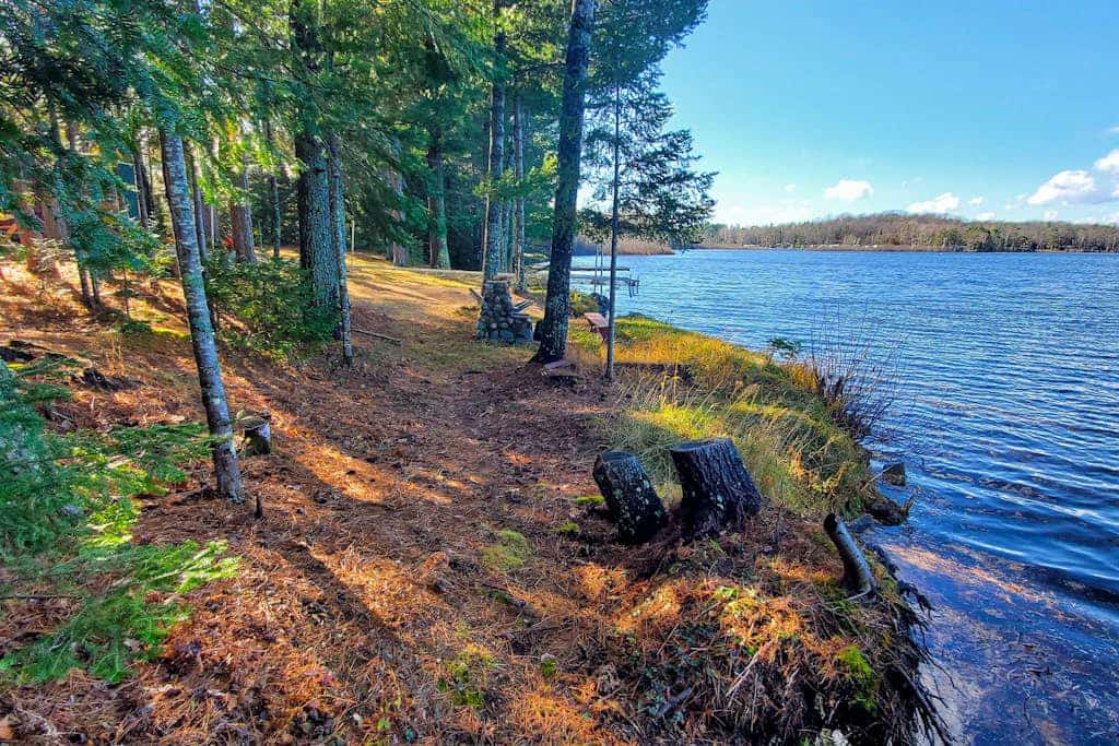 Lakefront home with, dock, kayaks, paddle boards, fire pit & more