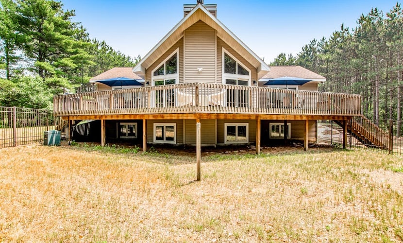 Secluded lake retreat with game room; near beach, boat rental, dining, and golf