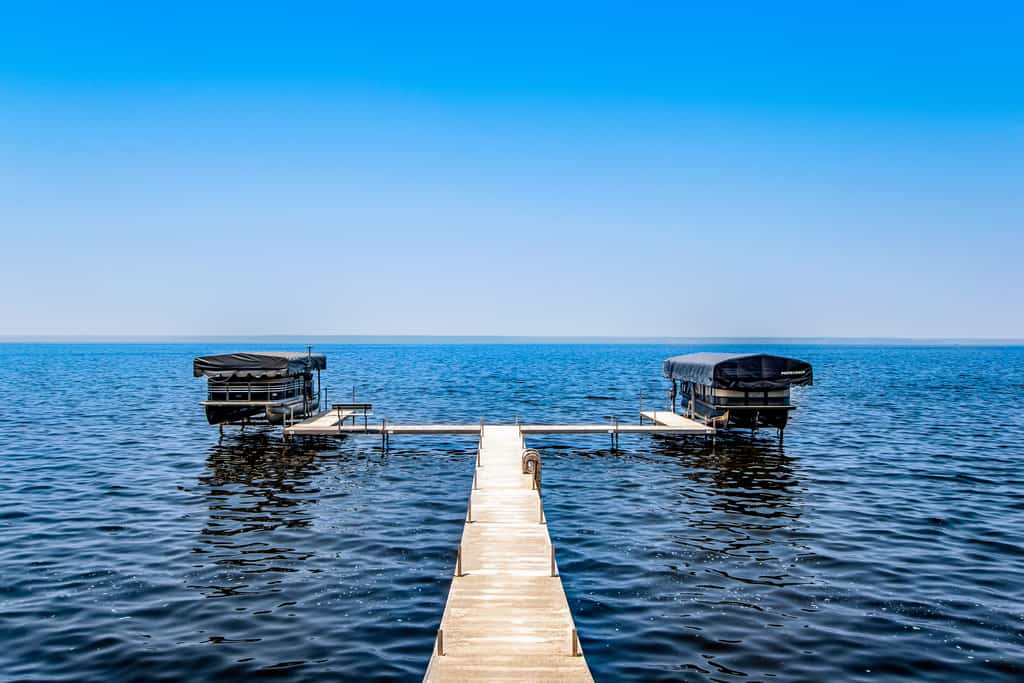 Secluded lake retreat with game room; near beach, boat rental, dining, and golf