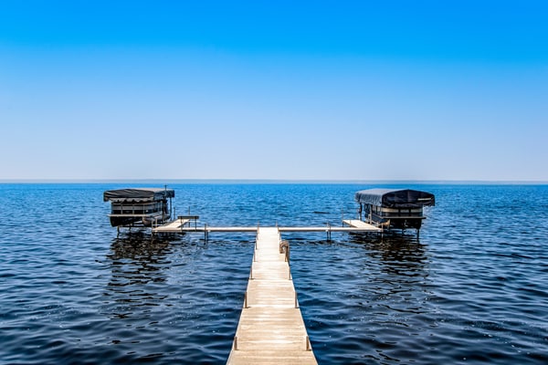 Secluded lake retreat with game room; near beach, boat rental, dining, and golf