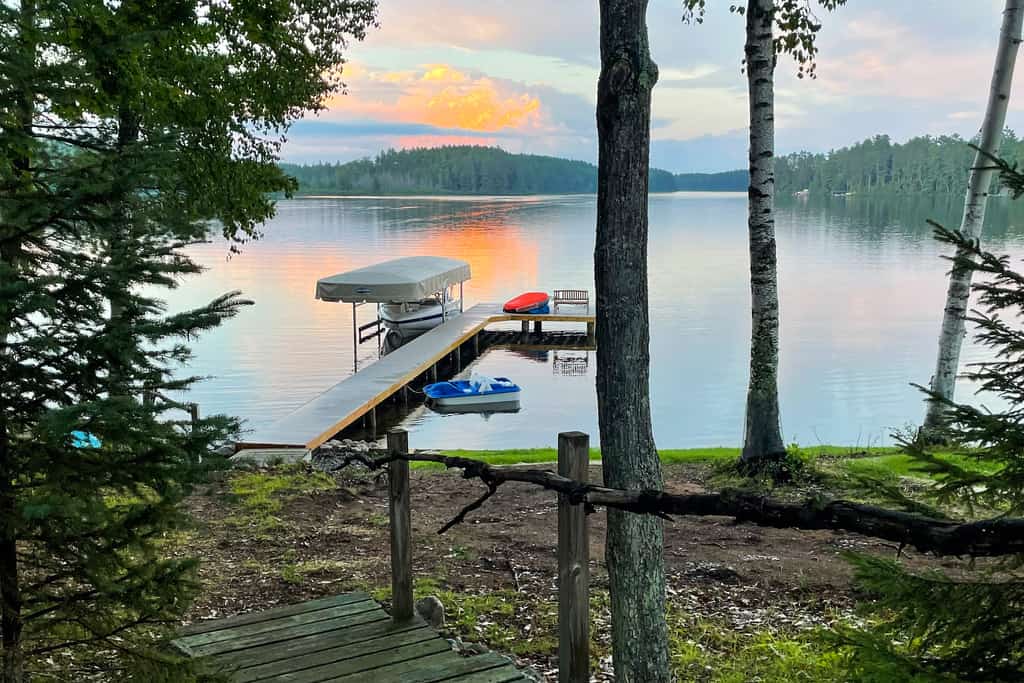Lakefront home with private dock, deck, fireplace, firepit, canoe & paddleboat
