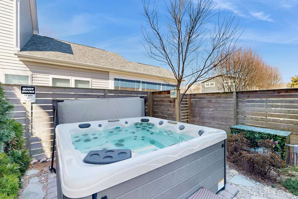 Dog-friendly home 3.5 blocks to beach w/private hot tub, balconies, firepit, AC