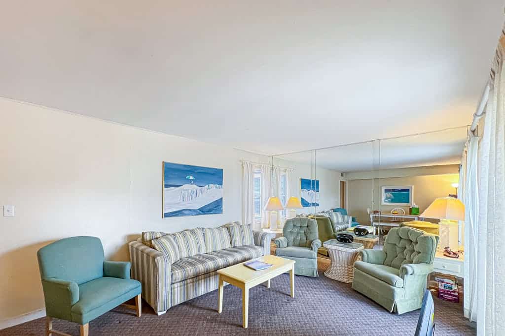 2nd-floor Sunspot condo steps from beach with balcony, outdoor shower, W/D, & AC