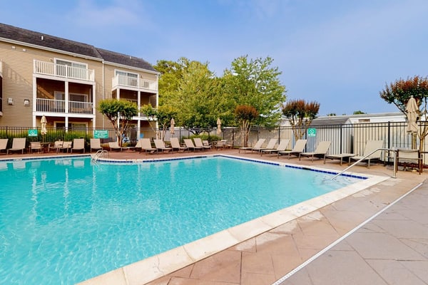 Rehoboth Crossing townhouse with pool, gym, balcony, grill, W/D, bikes, & patio