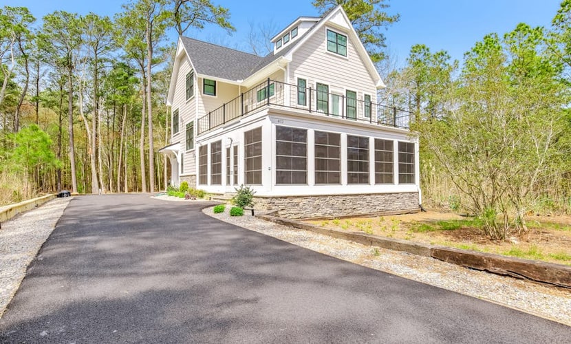 Pond Acres paradise with sunroom, central AC, & washer/dryer