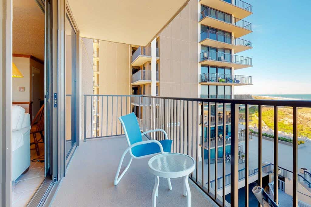 Sea Colony corner condo with ocean views, wraparound balcony, pools, & beach