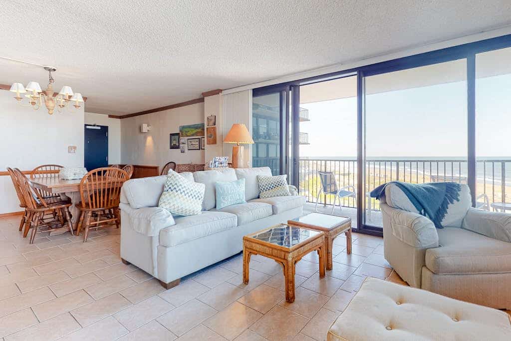 Sea Colony corner condo with ocean views, wraparound balcony, pools, & beach
