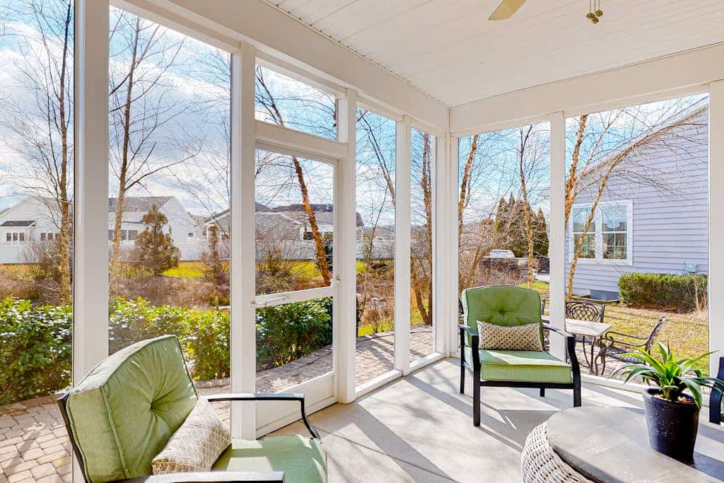 Millville by the Sea home with sunroom, fireplace & great amenity add-ons