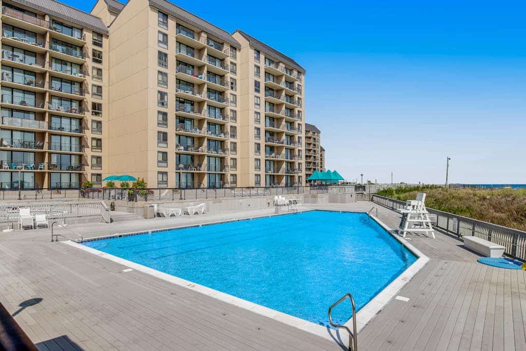 Sea Colony condo with pools, hot tub, tennis, gym, & private deck
