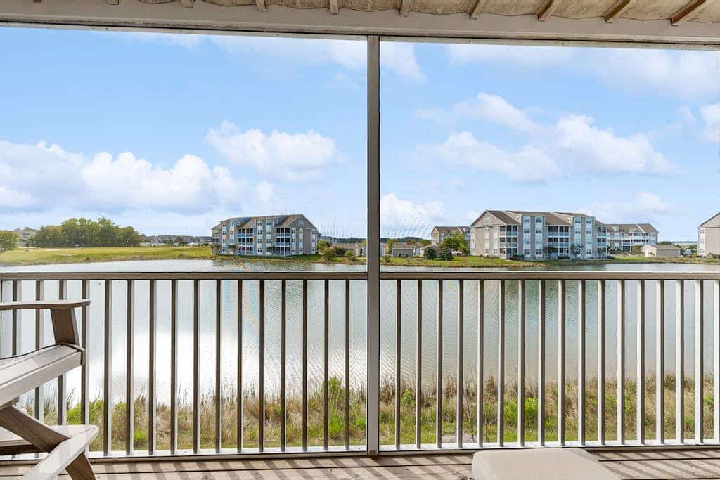 2nd-floor Bethany Bay condo with waterfront views & on-site golf/pool/tennis