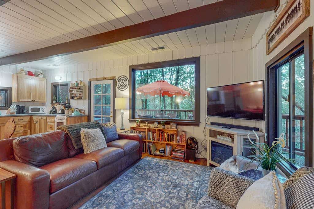 Slip into the hot tub as redwoods sway overhead and the forest settles into evening quiet. This dog-friendly hideaway brings your pup along for riverside adventures — the Russian River flows just 0.2 miles away. Cozy up with 4 in this colorful cabin after wine tasting at Porter Creek (2.1 mi) or paddling from Burke's Canoe Trips. Your forest retreat sits minutes from Forestville's tasting rooms yet feels worlds away in the trees.